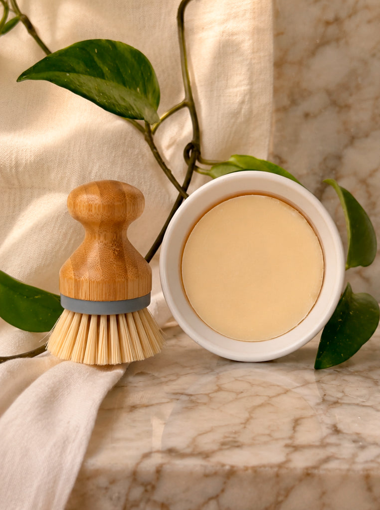 Olive & Tallow natural solid dish soap block on a kitchen counter