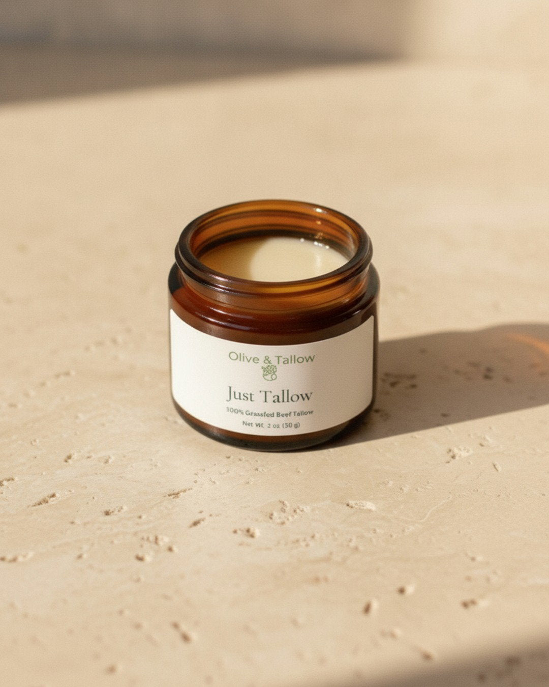 Open jar of plain unscented grass-fed tallow balm