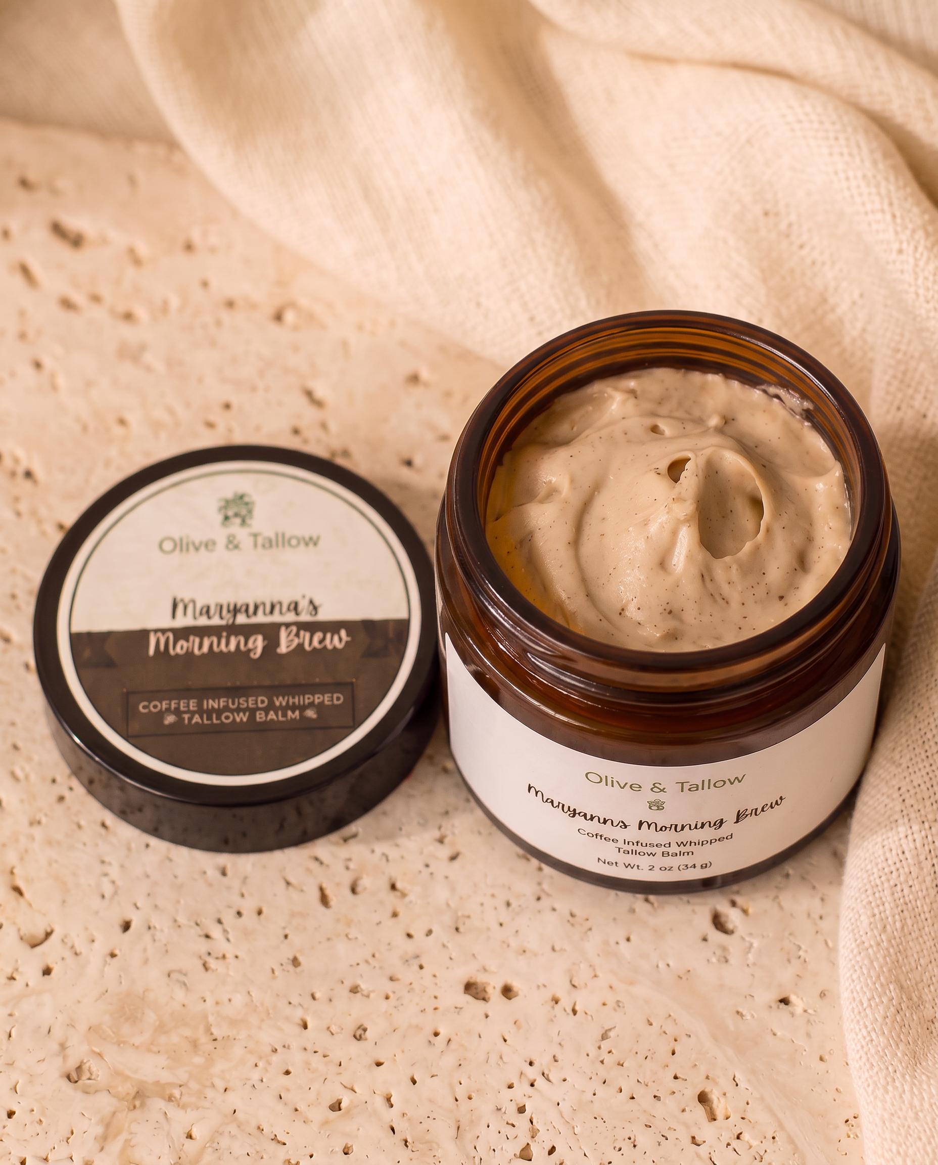 Open jar of coffee-infused grass-fed tallow balm